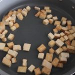 stir fry dried tofu in a pan