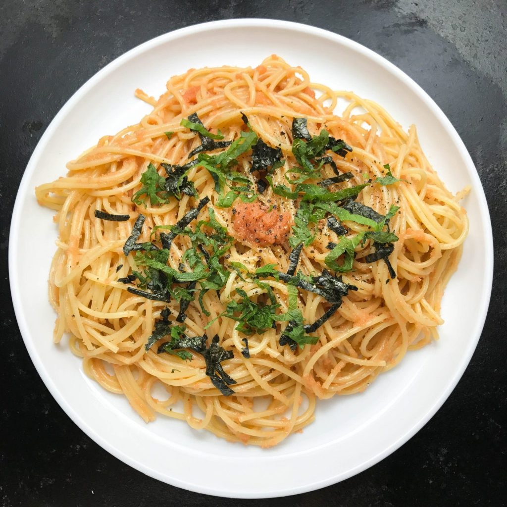 mentaiko pasta with olive oil and shiso top view