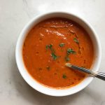 Tomato Soup with Butter, Red Onion, and Basil top view