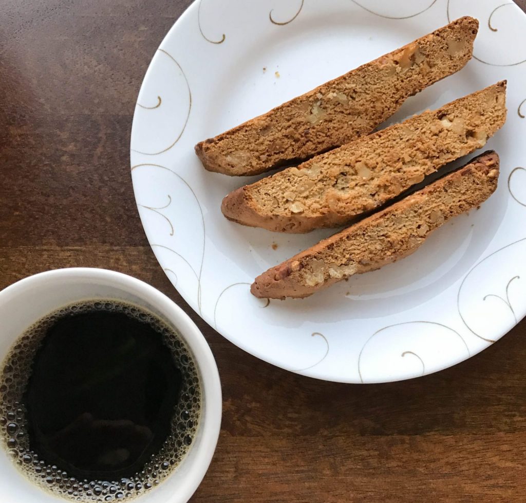 bread on a plate with coffee