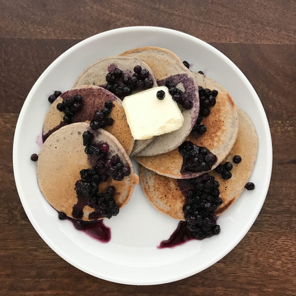 blue berry pancakes with butter on top
