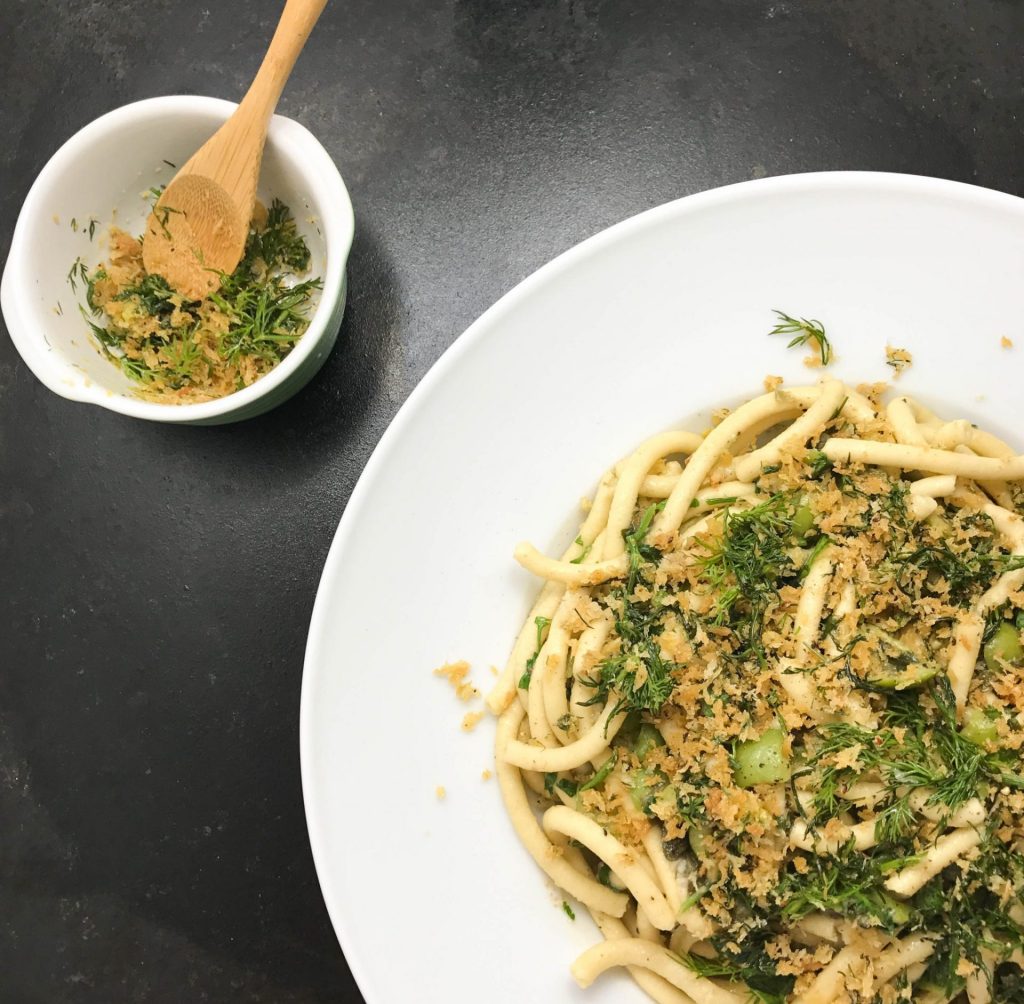 Bucatini pasta with broccoli and parmesan.