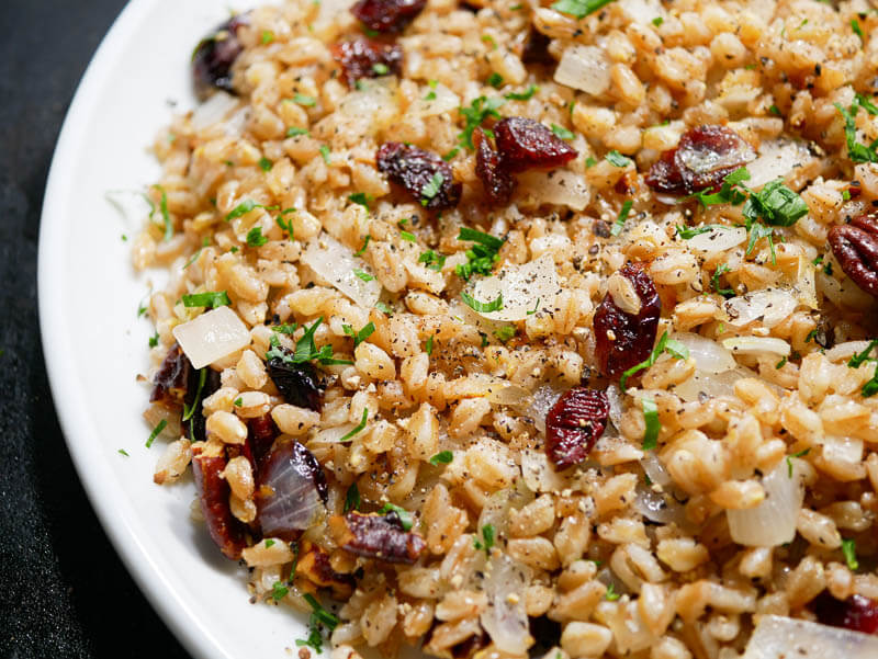 Warm Farro Recipe with Buttered Onions, Cranberries & Pecans closeup