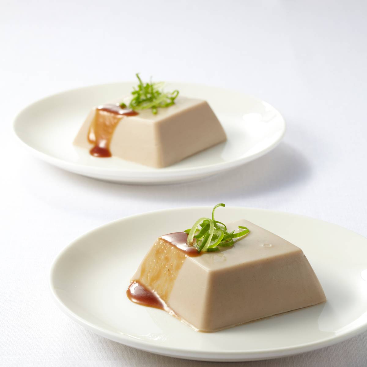 Presentation of raw tofu on a plate