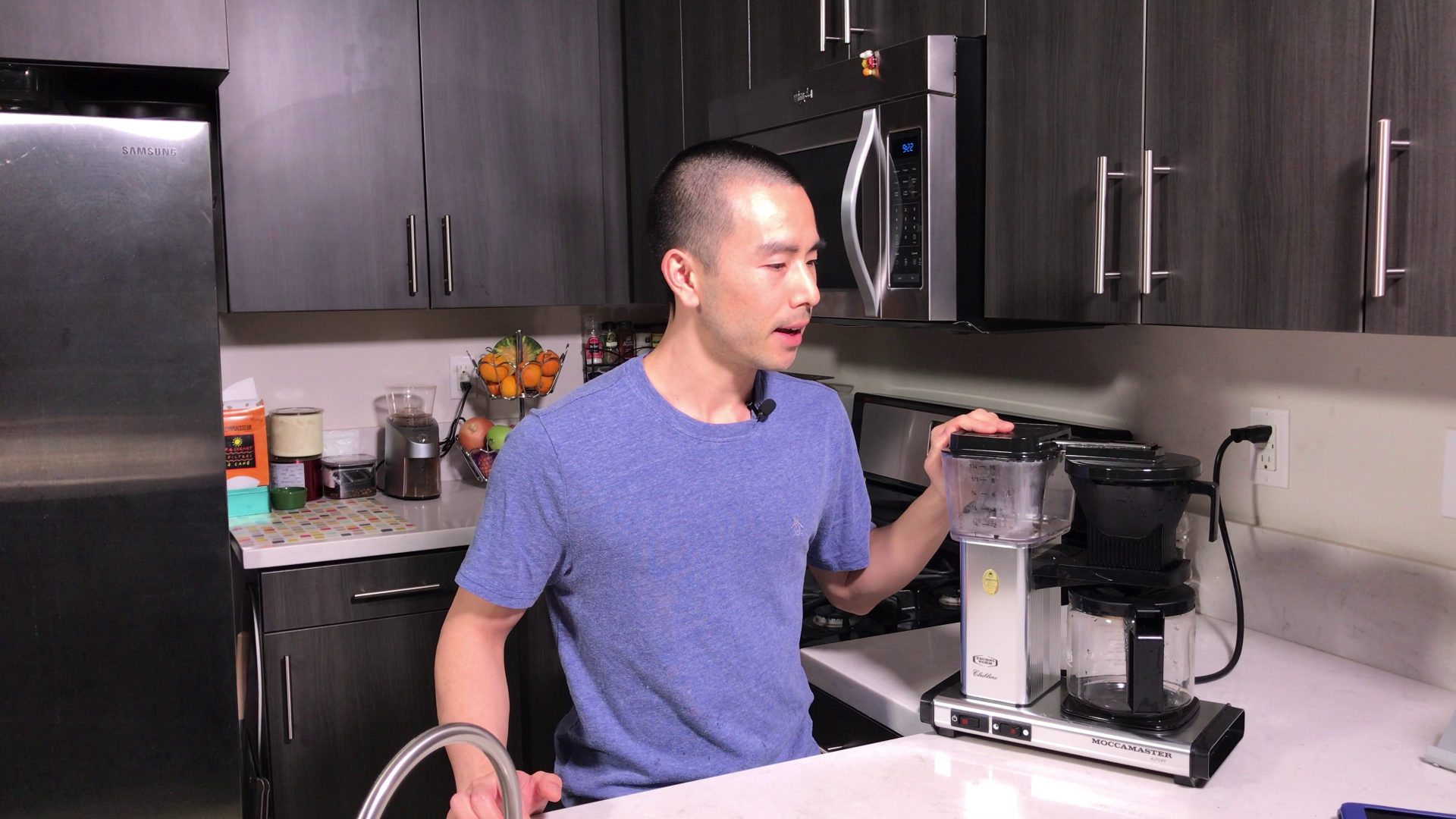 Pat Tokuyama in his kitchen holding technivorm moccamaster coffee machine