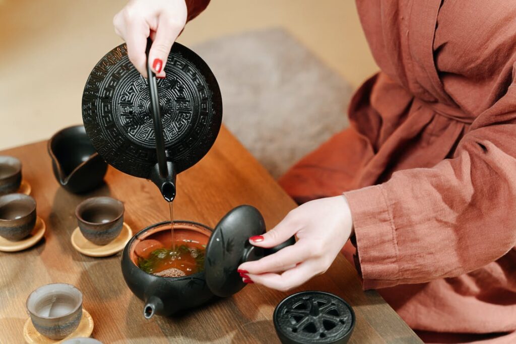 pouring hot water into a tea pot