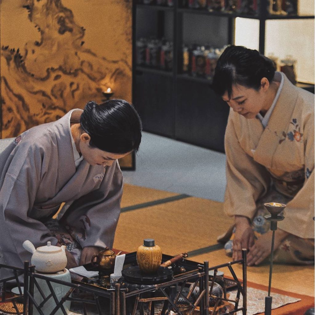 Two women in Kyoto preparing tea.