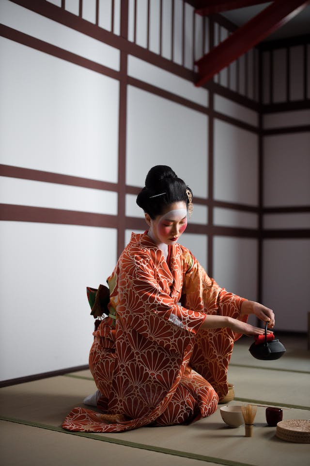 a geisha pouring tea