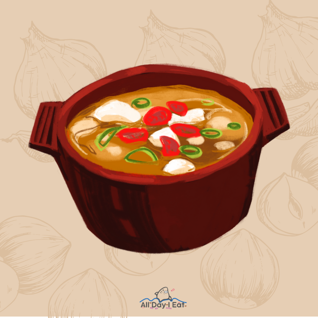 A drawing of a pot of soup with freeze onions and garlic.