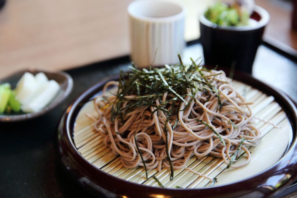 soba Japanese noodles on a wooden plate