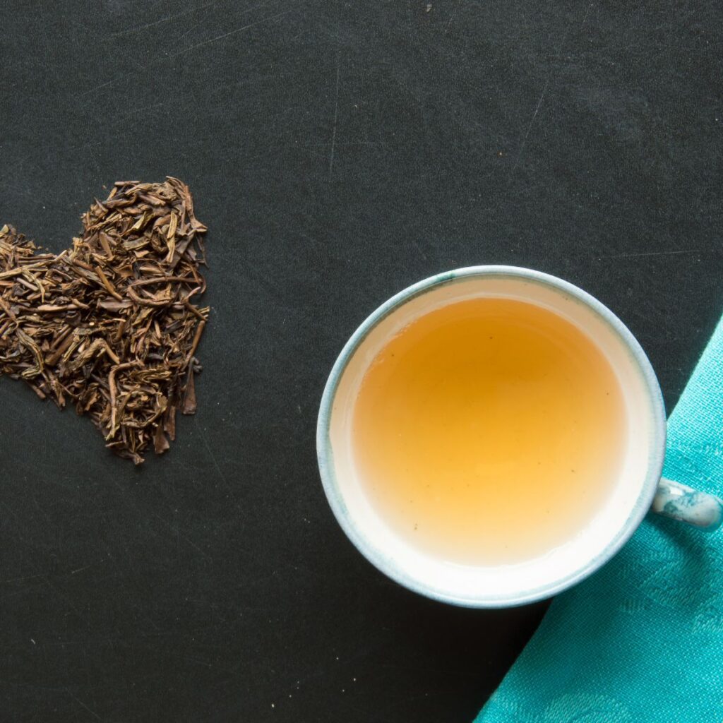 bancha tea in a cup with heart tea leaves